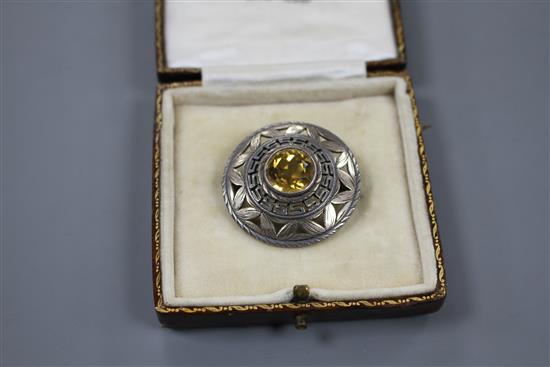A 1960s Sybil Dunlop pierced parcel gilt silver and citrine set target brooch, London, 1965, 32mm, gross 9.1 grams.